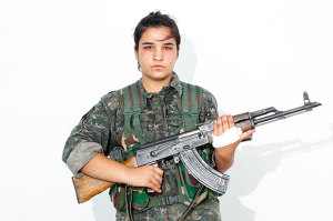 Zevin Botan, 20. Photographed at a YPJ checkpoint-base, on the outskirts of Rabia, Kurdistan, on Aug. 7, 2014.