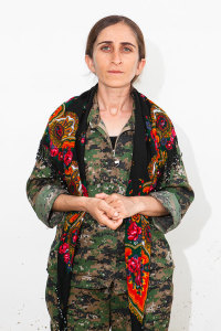 Shavin Bachouk, 26. Photographed at a YPJ checkpoint-base, on the outskirts of Rabia, Kurdistan, on Aug. 7, 2014.