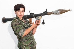 Hasrat Sahad, 23. Photographed at a YPJ checkpoint-base, on the outskirts of Rabia, Kurdistan, on Aug. 7, 2014.