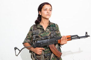 Avinar Kolcer, 26. Photographed at a YPJ checkpoint-base, on the outskirts of Rabia, Kurdistan, on Aug. 7, 2014.