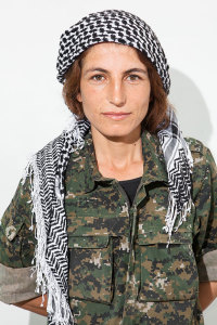 Evin Ahmed, 26. Photographed at a YPJ checkpoint-base, on the outskirts of Rabia, Kurdistan, on Aug. 7, 2014.