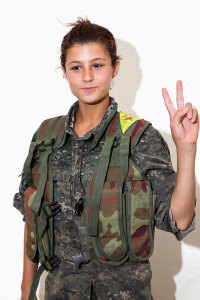 Mizguin Emraly, 14. Photographed at a YPJ checkpoint-base, on the outskirts of Rabia, Kurdistan, on Aug. 7, 2014