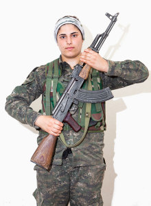 Evin Sadak, 20. Photographed at a YPJ training base near Derek City, Syria, Aug. 20, 2014.